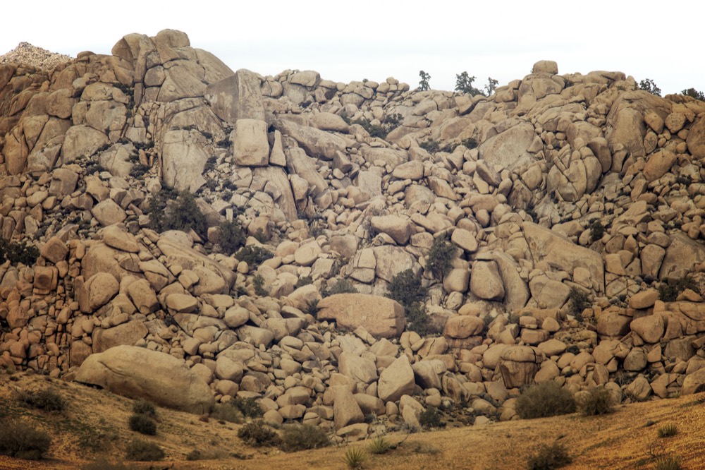 A dense hillside of granite boulders